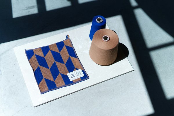 What are the best ways to experience the historical significance of the British wool industry in Wales?